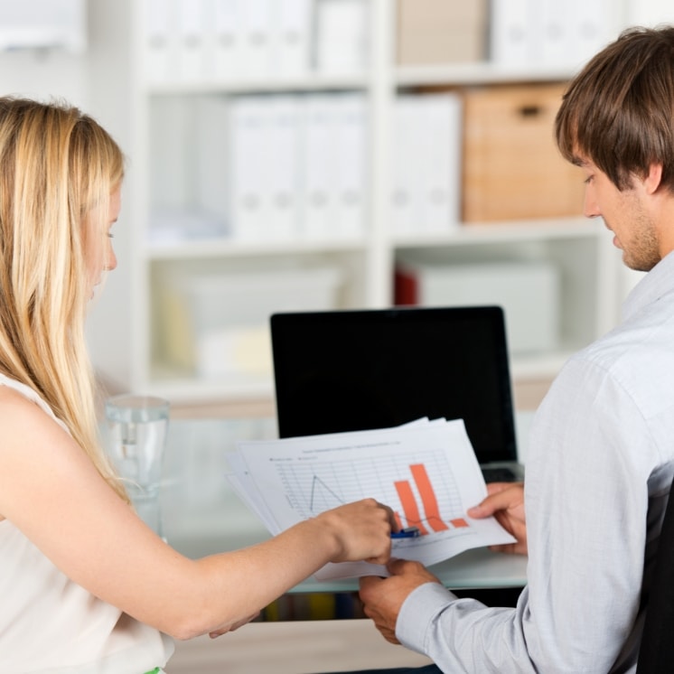 woman showing facts graph to man