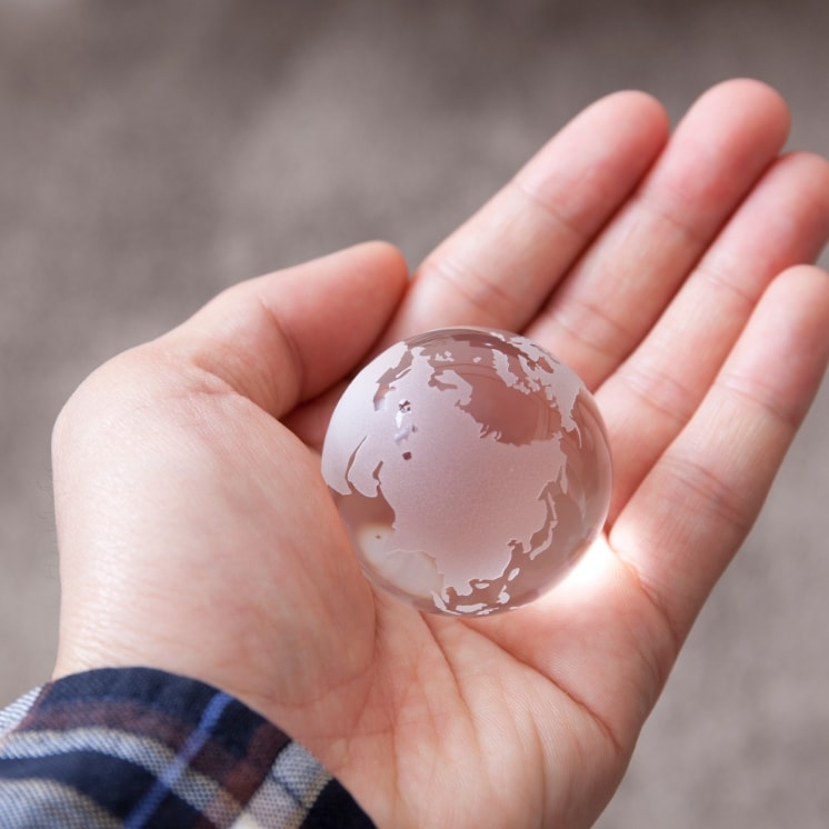 small globe on hand