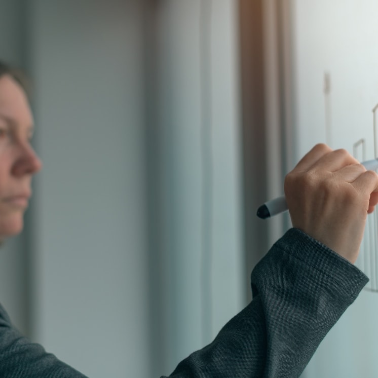 Girl writing something on board