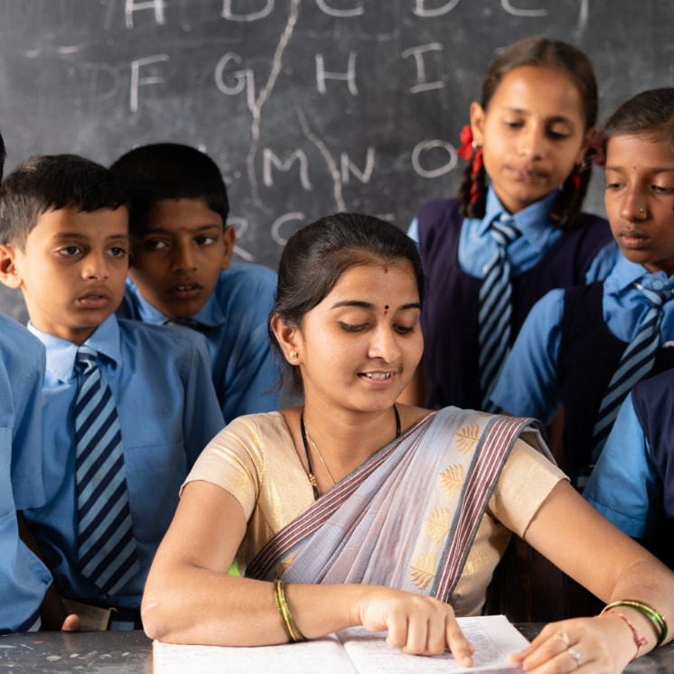 teacher with students at classroom