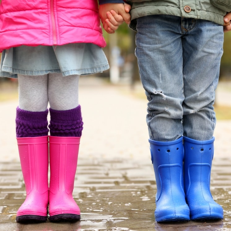 kids in pink and blue boots